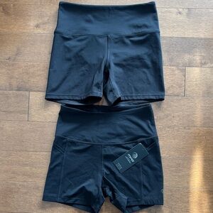 TWO pairs of black high waisted athletic shorts